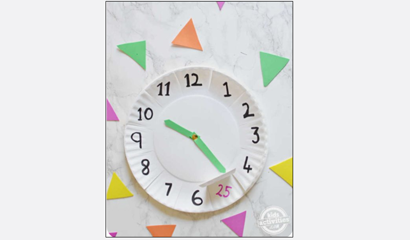 a clock made with a paper plate