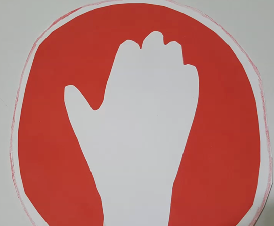a stop sign with a white hand on a red backgroudn